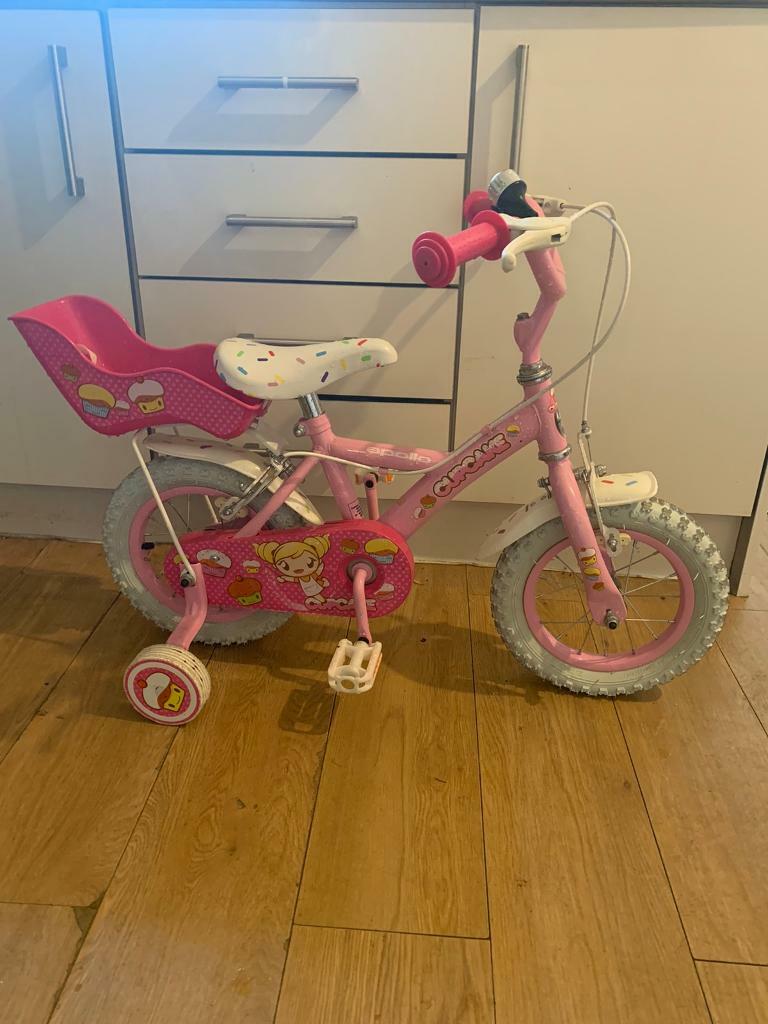 little girl bike with doll carrier